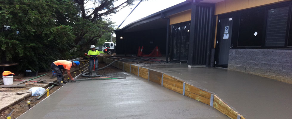Freshly poured accessible concrete pathways and ramps