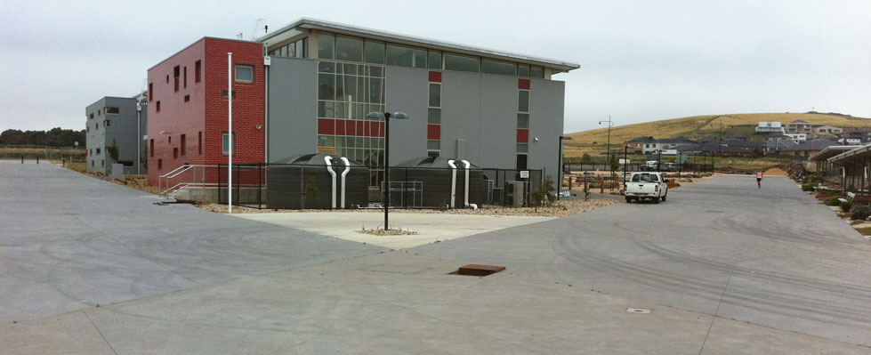 Concrete roadways and kerbs surrounding a commercial building